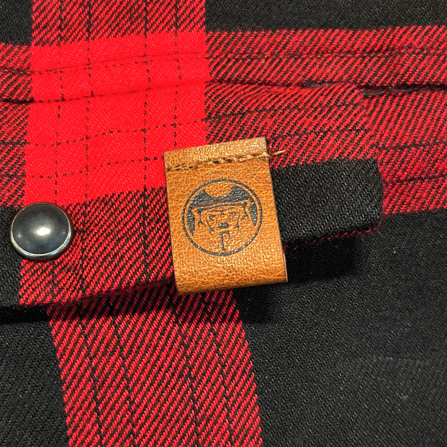 Red Flannel NAN Leather Tag Close Up